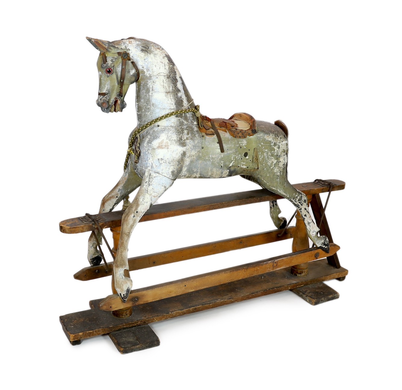 A Victorian carved and painted wood rocking horse, 174cm long 145cm high